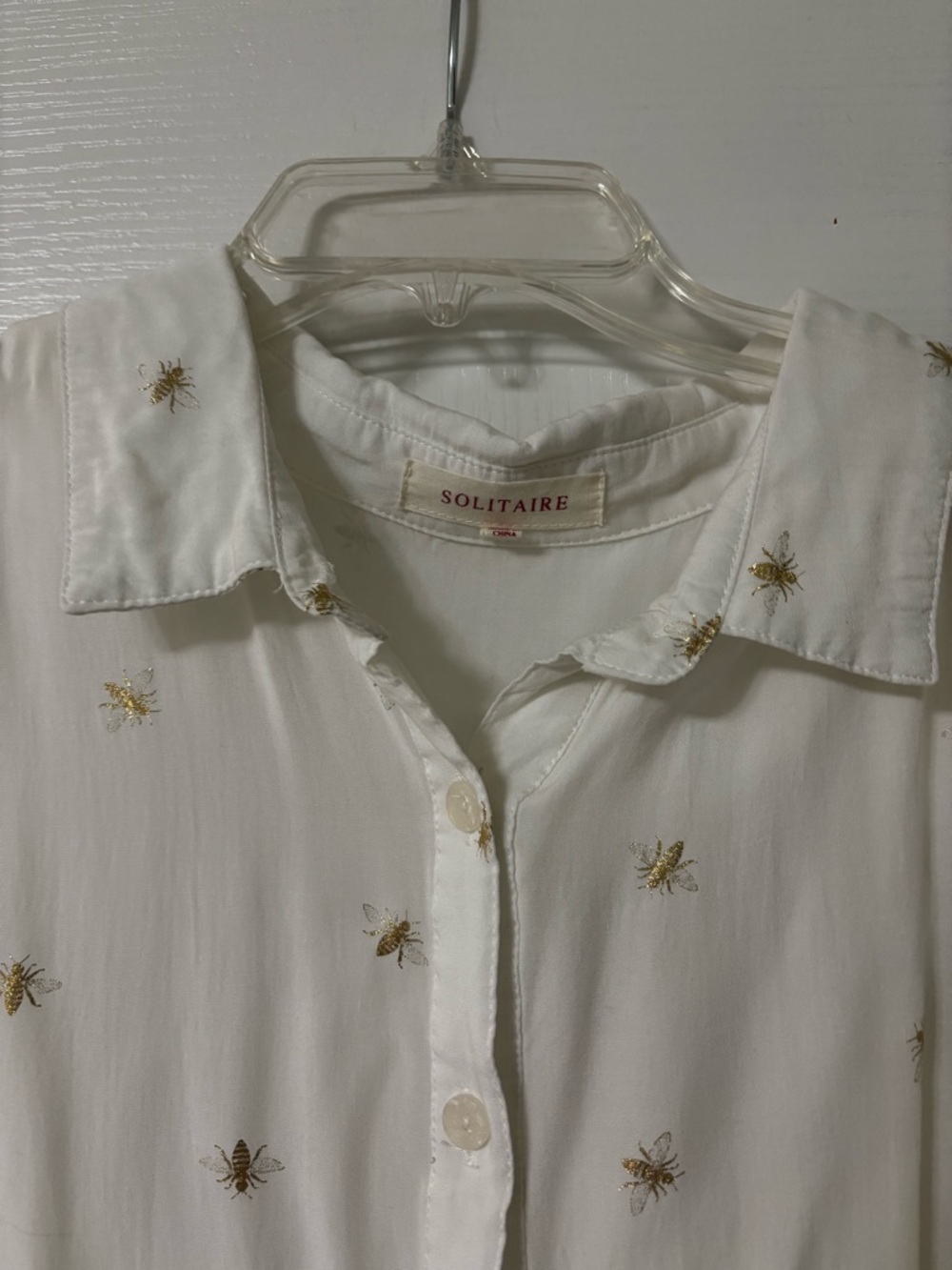 Solitaire White Sleeveless Button-Front Blouse with Gold Bees Embroidered. - Picture 2 of 7